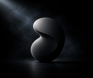 A sculpted mark turning under a key light
